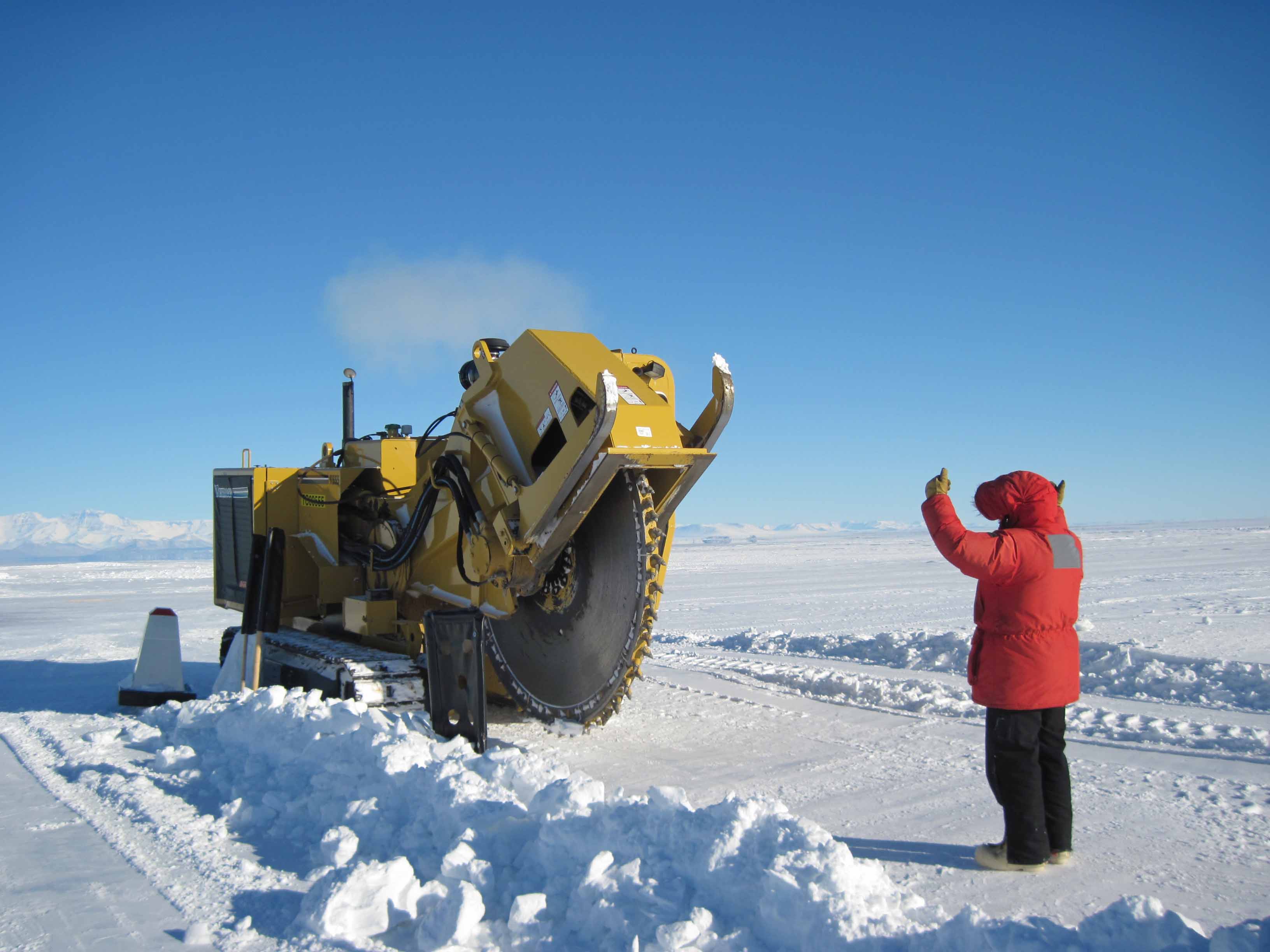 Researchers work on the "Pegasus Glacial Runway" that supports McMurdo Station, Antarctica